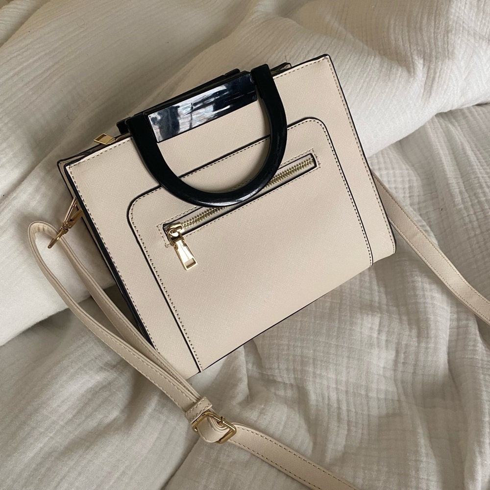 Elegant Cream Handbag with and Gold Black Accents